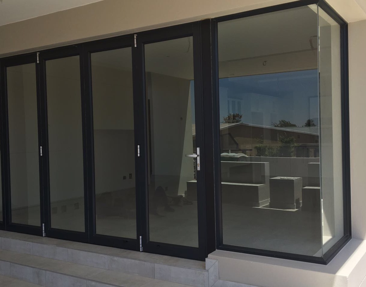 Modern folding stacker aluminium doors — residential patio