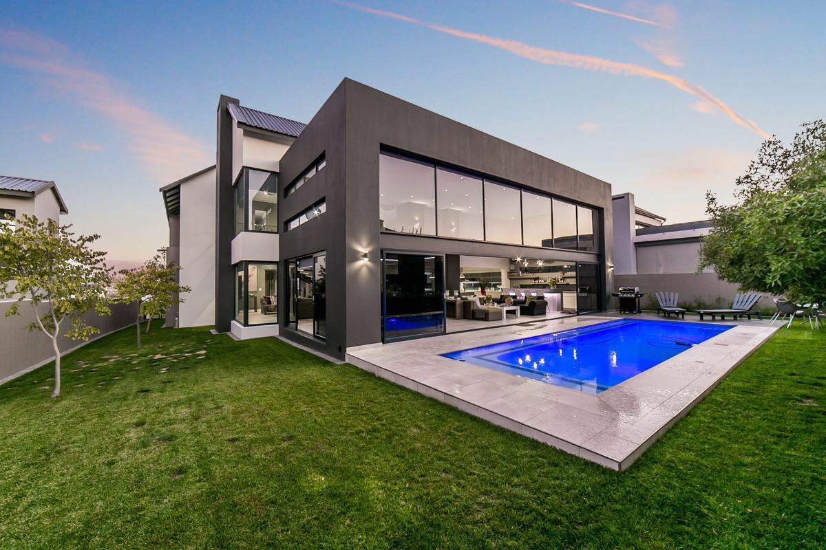 Luxury residential villa with full-height aluminium glazing and folding doors