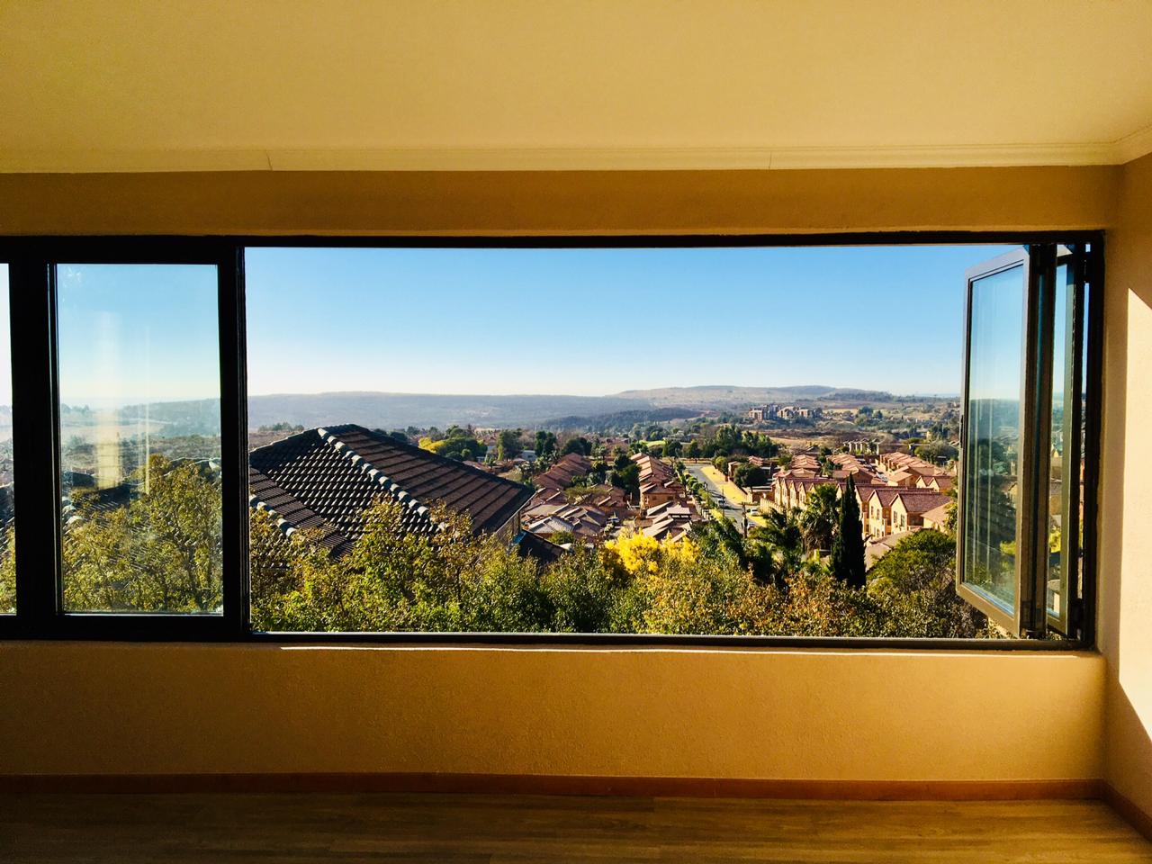 Custom aluminium sliding windows — panoramic view, installed by VG Aluminium